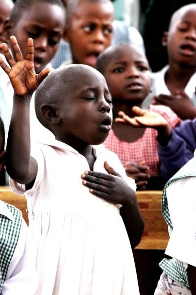 African girl worshiping
